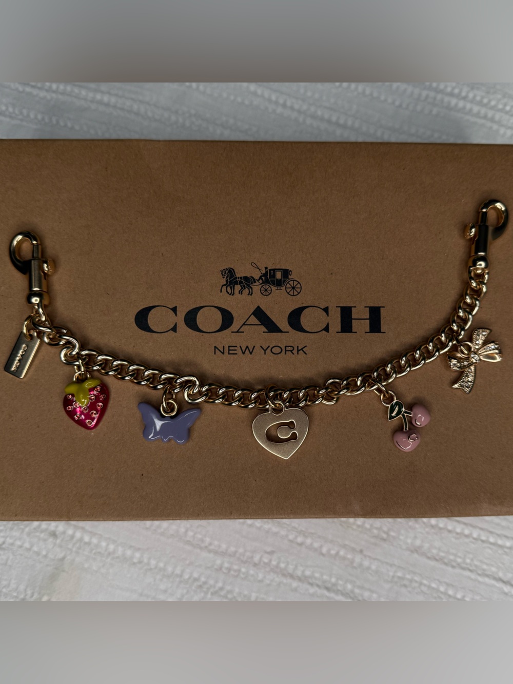 Coach Gold-Tone Charm Bracelet with Pink, Purple, Red and Gold Charms